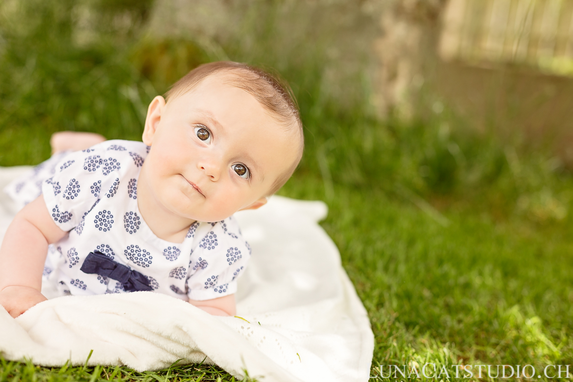 6 month baby on the tummy outdoor photo